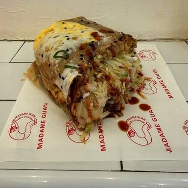 Spicy chicken and mozzarella jianbing, drizzled with house chilli sauce