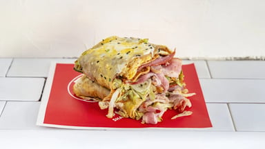 Grilled bacon jianbing, crispy Chinese crêpe cut in two